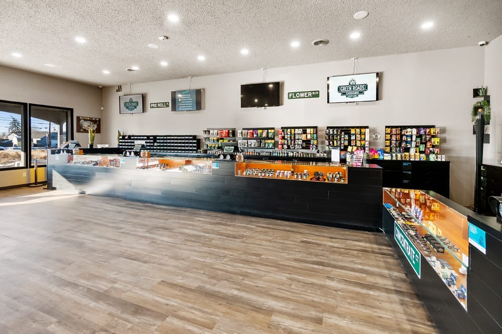 wide shot of dispensary counter and products at green roads cannabis